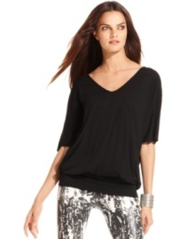 Dramatically full sleeves and a keyhole in back create a captivating look on INC's petite tunic top. Dramatically full sleeves and a keyhole in back create a captivating look on INC's petite tunic top.