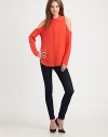 Downtown-cool cutout shoulders and a hi-low hem update this lengthy silk staple. Point collarCutout shouldersButton frontLong sleevesButtoned cuffsHi-low hem hits below the hipsSilkDry cleanImportedModel shown is 5'10 (177cm) wearing US size Small.