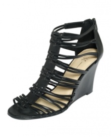 The strappier the better. The Dania wedge sandals by INC International Concepts take the gladiator trend to new heights with a stacked wedge heel. The strappier the better. The Dania wedge sandals by INC International Concepts take the gladiator trend to new heights with a stacked wedge heel.