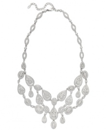 The name says it all. Eliot Danori's all-around Windsor statement necklace brings high shine to any look with its stunning crystal design and rhodium-plated mixed metal setting. Approximate length: 16 inches + 2-inch extender. Approximate drop: 2 inches. The name says it all. Eliot Danori's all-around Windsor statement necklace brings high shine to any look with its stunning crystal design and rhodium-plated mixed metal setting. Approximate length: 16 inches + 2-inch extender. Approximate drop: 2 inches.