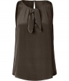 Elegant beluga silk top from Marc by Marc Jacobs - Inject your closet with sophisticated style with this sleeveless silk top - On-trend A-line silhouette with a chic tie-neck - Pair with flared jeans, a bold-shoulder blazer, and wedge heels - Try with ribbed leggings, an A-line wool coat, and over-the-knee boots
