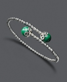Your sense of style will make others green with envy. This chic, wrapped cuff features a sterling silver sparkle bead setting accented with malachite (10-3/4 ct. tw.) ends. Approximate length: 7-1/2 inches. Your sense of style will make others green with envy. This chic, wrapped cuff features a sterling silver sparkle bead setting accented with malachite (10-3/4 ct. tw.) ends. Approximate length: 7-1/2 inches.