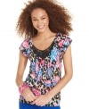 So dynamic! From the super colorful print to the crisscross back design, this top from Belle Du Jour nails T.K.O. style!