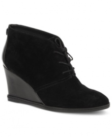 Streamlined appeal. Etienne Aigner's Zita single sole booties feature a subtle lace-up closure and a wedge heel. Streamlined appeal. Etienne Aigner's Zita single sole booties feature a subtle lace-up closure and a wedge heel.