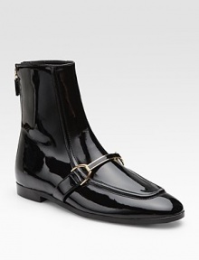 Perfectly polished style channels old-world charm with its classic faux patent leather silhouette and goldtone buckle. Exposed back zipper Faux leather lining and sole Padded insole 78% polyurethane/15½% nylon/6½% viscose upper Made in Italy Perfectly polished style channels old-world charm with its classic faux patent leather silhouette and goldtone buckle. Exposed back zipper Faux leather lining and sole Padded insole 78% polyurethane/15½% nylon/6½% viscose upper Made in Italy