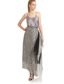 THE LOOKScoopneckThin spaghetti strapsGently ruffled hemV-backTHE FITAbout 24 from shoulder to hemTHE MATERIALSilkCARE & ORIGINDry cleanMade in ItalyModel shown is 5'10½ (179cm) wearing US size 4. THE LOOKScoopneckThin spaghetti strapsGently ruffled hemV-backTHE FITAbout 24 from shoulder to hemTHE MATERIALSilkCARE & ORIGINDry cleanMade in ItalyModel shown is 5'10½ (179cm) wearing US size 4.