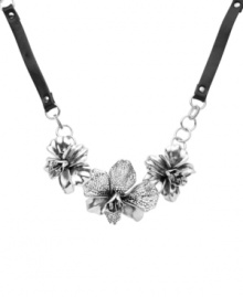 Nature's inspiration. Fossil's bold and beautiful necklace features three carefully-detailed orchids with clear crystal accents and openwork detailing. Set in silver tone mixed metal and strong on a chocolate leather chain. Features a lobster claw closure. Approximate length: 18 inches + 2-inch extender. Nature's inspiration. Fossil's bold and beautiful necklace features three carefully-detailed orchids with clear crystal accents and openwork detailing. Set in silver tone mixed metal and strong on a chocolate leather chain. Features a lobster claw closure. Approximate length: 18 inches + 2-inch extender.