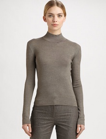 A melange cashmere/silk blend makes up this sleek, form-fitting piece.Mock neckLong sleeves50% cashmere/50% silkDry cleanMade in SwitzerlandModel shown is 5'11 (180cm) wearing US size 4. 