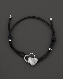 Discover the new Frederique Constant Double Heart Jewelry Collection. Perfectly in line with the Frederique Constant timepiece collection, our jewelry designs effortlessly harmonize the classical with the contemporary for a woman who is elegant, yet spontaneous, sophisticated, and has a strong sense of herself. With an emphasis on exquisite workmanship, we introduce a jewelry collection that incorporates 18K rose gold and sterling silver with diamonds, offering 'easy,' wearable pieces as an everyday luxury. Designed by a lady, for a lady and developed with passion to reflect the aspirations of today's woman in the spirit of what Frederique Constant is famous for: accessible luxury. Sterling silver pavé diamond Double Heart bracelet featured on adjustable black cord. Discover the new Frederique Constant Double Heart Jewelry Collection. Perfectly in line with the Frederique Constant timepiece collection, our jewelry designs effortlessly harmonize the classical with the contemporary for a woman who is elegant, yet spontaneous, sophisticated, and has a strong sense of herself. With an emphasis on exquisite workmanship, we introduce a jewelry collection that incorporates 18K rose gold and sterling silver with diamonds, offering 'easy,' wearable pieces as an everyday luxury. Designed by a lady, for a lady and developed with passion to reflect the aspirations of today's woman in the spirit of what Frederique Constant is famous for: accessible luxury. Sterling silver pavé diamond Double Heart bracelet featured on adjustable black cord.