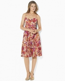 Bright blooms lend breezy vintage charm to a softly ruched surplice dress in airy georgette, finished with a full, sweeping skirt for dramatic movement. Bright blooms lend breezy vintage charm to a softly ruched surplice dress in airy georgette, finished with a full, sweeping skirt for dramatic movement.