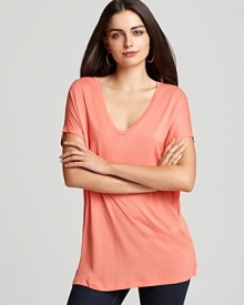 Marry a refreshing hue and a deep scoop neckline and the result is this flowing Vince top, a spring update to the basic tee that's ever-so perfect with your favorite jeans.