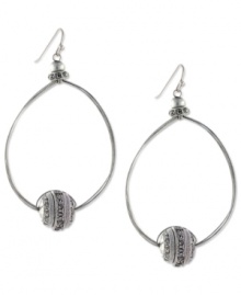 Well-rounded fashion from Jessica Simpson. These oval hoop earrings showcase round crystal accents. Crafted in antiqued worn silver tone mixed metal. Approximate drop: 2-1/2 inches. Well-rounded fashion from Jessica Simpson. These oval hoop earrings showcase round crystal accents. Crafted in antiqued worn silver tone mixed metal. Approximate drop: 2-1/2 inches.