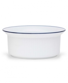 Named for a trendy Copenhagen neighborhood but designed with timeless style, the Christianshavn Blue serving bowl features a double band of navy in pristine white porcelain. From Dansk.