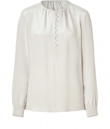Create an elegant and polished look at the office and beyond with this silk blouse in grey-beige - Small, rounded neckline, button half-placket and subtle decorative ruffles at collar - Long sleeves feature buttoned cuffs - Loose, straight silhouette - Dress up skinny jeans or wear with a pencil skirt or under a suit Create an elegant and polished look at the office and beyond with this silk blouse in grey-beige - Small, rounded neckline, button half-placket and subtle decorative ruffles at collar - Long sleeves feature buttoned cuffs - Loose, straight silhouette - Dress up skinny jeans or wear with a pencil skirt or under a suit