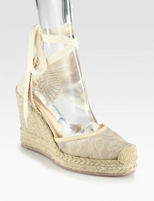 Semi-sheer floral lace and wrap-around ties add feminine style to this woven design, lifted by a textured espadrille wedge. Covered wedge, 4 (100mm)Covered platform, 1 (25mm)Compares to a 3 heel (75mm)Lace and woven fabric upper with leather trimLeather liningRubber trek solePadded insoleMade in Italy