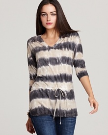Rendered in a bold tie-dye print, this C&C California top features a cinched waist for the perfect fit. Rendered in a bold tie-dye print, this C&C California top features a cinched waist for the perfect fit.