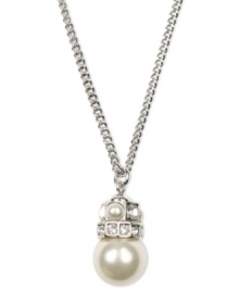 Simplicity and subtlety combine. This effortlessly gorgeous Givenchy necklace highlights a polished glass pearl (10 mm) and sparkling crystals set in silver tone mixed metal. Approximate length: 18 inches. Approximate drop: 1 inch. Simplicity and subtlety combine. This effortlessly gorgeous Givenchy necklace highlights a polished glass pearl (10 mm) and sparkling crystals set in silver tone mixed metal. Approximate length: 18 inches. Approximate drop: 1 inch.