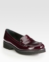 Classic patent penny loafer style. Rubber heel, 1¼ (30mm)Rubber platform, ½ (15mm)Compares to a ¾ heel (20mm)Patent leather upperLeather liningRubber trek solePadded insoleImported