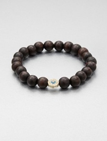 From the Devout Collection. A natural, wood beaded bracelet accented with a diamond and enamel embellished 14k gold evil eye. Wood14k goldDiamonds, .19 tcwLength, about 6.5Slip-on styleImported From the Devout Collection. A natural, wood beaded bracelet accented with a diamond and enamel embellished 14k gold evil eye. Wood14k goldDiamonds, .19 tcwLength, about 6.5Slip-on styleImported