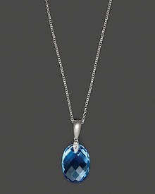 Diamonds accent a checkerboard blue topaz, set in 14K white gold. Diamonds accent a checkerboard blue topaz, set in 14K white gold.