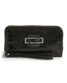 Take a walk on the wild side with this glossy crocodile print wallet by GUESS. Silvertone hardware and a sleek signature plaque add a polished edge to this rocker-chic design. Take a walk on the wild side with this glossy crocodile print wallet by GUESS. Silvertone hardware and a sleek signature plaque add a polished edge to this rocker-chic design.
