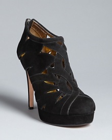 DKNY gives this season's must-buy booties added appeal with intricate cut outs. Wear bare, with black hose, or bright tights to show off the pattern. DKNY gives this season's must-buy booties added appeal with intricate cut outs. Wear bare, with black hose, or bright tights to show off the pattern.