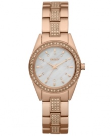 An elegant timepiece fit for every season, by DKNY. Crafted of rose-gold ion-plated stainless steel bracelet embellished with 90 crystal accents and oval stainless steel case. Bezel embellished with 46 crystal accents. White dial features 12 rose-gold tone crystal dot markers, rose-gold tone three hands and logo at twelve o'clock. Quartz movement. Water resistant to 50 meters. Two-year limited warranty. An elegant timepiece fit for every season, by DKNY. Crafted of rose-gold ion-plated stainless steel bracelet embellished with 90 crystal accents and oval stainless steel case. Bezel embellished with 46 crystal accents. White dial features 12 rose-gold tone crystal dot markers, rose-gold tone three hands and logo at twelve o'clock. Quartz movement. Water resistant to 50 meters. Two-year limited warranty.