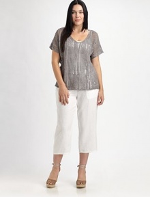 Shimmer and shine in this airy knit enhanced by metallic thread. It also features a feminine neckline and beloved fit.V-neckShort sleevesPull-on styleAbout 23 from shoulder to hem83% linen/16% metallic thread/1% cottonHand washImported of Italian fabric Shimmer and shine in this airy knit enhanced by metallic thread. It also features a feminine neckline and beloved fit.V-neckShort sleevesPull-on styleAbout 23 from shoulder to hem83% linen/16% metallic thread/1% cottonHand washImported of Italian fabric