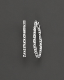 Prong set, inside out oval diamond hoop earrings set in white 14 Kt. gold. With hinged post. Prong set, inside out oval diamond hoop earrings set in white 14 Kt. gold. With hinged post.