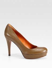 Leather staple with a slight platform and rounded toe. Self-covered heel, 4¼ (110mm)Self-covered platform, ¾ (20mm)Compares to a 3½ heel (90mm)Leather upperRound toeLeather lining and soleRubber trek soleMade in ItalyOUR FIT MODEL RECOMMENDS ordering true size. Leather staple with a slight platform and rounded toe. Self-covered heel, 4¼ (110mm)Self-covered platform, ¾ (20mm)Compares to a 3½ heel (90mm)Leather upperRound toeLeather lining and soleRubber trek soleMade in ItalyOUR FIT MODEL RECOMMENDS ordering true size.