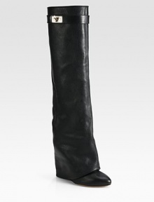 A metal turn-lock adds polish to this ultra-tall foldover silhouette, crafted of rich pebble-grain leather. Self-covered heel, 4¾ (120mm)Shaft, 16½Leg circumference, 13Leather upperLeather lining and solePadded insoleMade in ItalyOUR FIT MODEL RECOMMENDS ordering one size up as this style runs small. A metal turn-lock adds polish to this ultra-tall foldover silhouette, crafted of rich pebble-grain leather. Self-covered heel, 4¾ (120mm)Shaft, 16½Leg circumference, 13Leather upperLeather lining and solePadded insoleMade in ItalyOUR FIT MODEL RECOMMENDS ordering one size up as this style runs small.