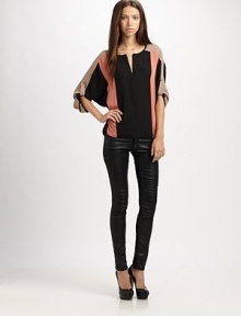 Bold colorblock adds graphic appeal to this draped hi-lo hem top.Split v-neckDropped shouldersRoll-tab dolman sleevesHi-lo hemPolyesterDry cleanImportedModel shown is 5'11 (180cm) wearing US size Small. Bold colorblock adds graphic appeal to this draped hi-lo hem top.Split v-neckDropped shouldersRoll-tab dolman sleevesHi-lo hemPolyesterDry cleanImportedModel shown is 5'11 (180cm) wearing US size Small.