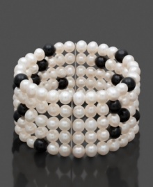 Startling specks of black in a white silhouette. This contrasting cuff will liven up your wardrobe. Bracelet features five rows of black and white cultured freshwater pearls (6-7 mm) in a sterling silver setting. Approximate length: 7 inches. Startling specks of black in a white silhouette. This contrasting cuff will liven up your wardrobe. Bracelet features five rows of black and white cultured freshwater pearls (6-7 mm) in a sterling silver setting. Approximate length: 7 inches.