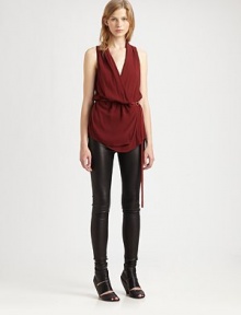 Lightweight fabric elegantly drapes on this crossover silhouette with a leather belt at the waist. Crossover v-neckSleeveless with frayed hemLeather self-tie belted waistAbout 29 from shoulder to hemBody: 75% viscose/25% virgin woolTrim: leatherDry cleanImported of Italian fabricModel shown is 5'10 (177cm) wearing US size Small. Lightweight fabric elegantly drapes on this crossover silhouette with a leather belt at the waist. Crossover v-neckSleeveless with frayed hemLeather self-tie belted waistAbout 29 from shoulder to hemBody: 75% viscose/25% virgin woolTrim: leatherDry cleanImported of Italian fabricModel shown is 5'10 (177cm) wearing US size Small.