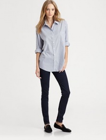 A striped cotton staple borrowed from the boys but tailored for the female body, with a flattering curved hem and delicate back pleating. Point collarButton closuresFront patch pocketLong sleeves with button cuffsCurved hemBack pleatingAbout 27 from shoulder to hemCottonDry cleanImportedModel shown is 5'9 (175cm) wearing US size Small. A striped cotton staple borrowed from the boys but tailored for the female body, with a flattering curved hem and delicate back pleating. Point collarButton closuresFront patch pocketLong sleeves with button cuffsCurved hemBack pleatingAbout 27 from shoulder to hemCottonDry cleanImportedModel shown is 5'9 (175cm) wearing US size Small.