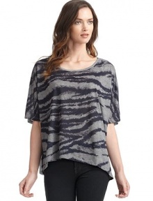THE LOOKScoop necklinePullover styleShort dolman sleevesFront zebra print with solid contrast backAsymmetrical hemLeft vented hemTHE FITLoose fit silhouetteAbout 29 from shoulder to longest point of hemTHE MATERIALPolyesterCARE & ORIGINMachine washImported THE LOOKScoop necklinePullover styleShort dolman sleevesFront zebra print with solid contrast backAsymmetrical hemLeft vented hemTHE FITLoose fit silhouetteAbout 29 from shoulder to longest point of hemTHE MATERIALPolyesterCARE & ORIGINMachine washImported