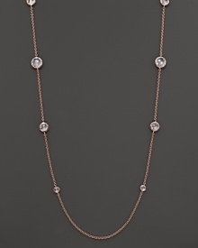 Ice-like drops of clear, bezel-set faceted quartz stud a chain of rose gold. Ice-like drops of clear, bezel-set faceted quartz stud a chain of rose gold.