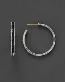 Sparkling sapphires detail a classic pair of sterling silver hoop earrings from Judith Ripka. Sparkling sapphires detail a classic pair of sterling silver hoop earrings from Judith Ripka.