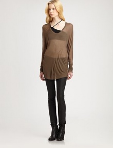 From the HELMUT capsule collection. Semi-sheer modal v-neck complemented by dropped shoulders and an ultra-long silhouette. Rounded v-neckDropped shouldersLong sleevesLonger length hits below the hipsModalDry cleanImportedModel shown is 5'10 (177cm) wearing US size Small. From the HELMUT capsule collection. Semi-sheer modal v-neck complemented by dropped shoulders and an ultra-long silhouette. Rounded v-neckDropped shouldersLong sleevesLonger length hits below the hipsModalDry cleanImportedModel shown is 5'10 (177cm) wearing US size Small.