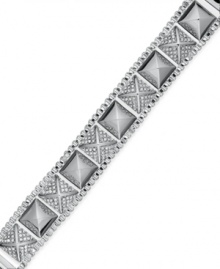 Style that's off the chain. Sleek studs are adorned with pave crystals on this chic box-chain bracelet from Juicy Couture. Crafted in silver tone brass. Approximate length: 6-1/3 inches. Style that's off the chain. Sleek studs are adorned with pave crystals on this chic box-chain bracelet from Juicy Couture. Crafted in silver tone brass. Approximate length: 6-1/3 inches.