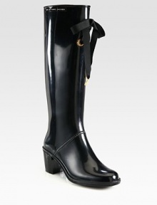 Metal-tip grosgrain ribbon and an elevated heel add feminine style to this rubber spring staple. Rubber heel, 2½ (65mm)Shaft, 14¾Leg circumference, 14¾Rubber upper with grosgrain ribbonLeather liningRubber trek solePadded insoleImportedOUR FIT MODEL RECOMMENDS ordering true whole size; ½ sizes should order the next whole size up. Metal-tip grosgrain ribbon and an elevated heel add feminine style to this rubber spring staple. Rubber heel, 2½ (65mm)Shaft, 14¾Leg circumference, 14¾Rubber upper with grosgrain ribbonLeather liningRubber trek solePadded insoleImportedOUR FIT MODEL RECOMMENDS ordering true whole size; ½ sizes should order the next whole size up.