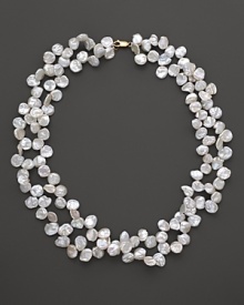Gleaming Keshi pearls in a double strand, finished with a 14K yellow gold clasp. Gleaming Keshi pearls in a double strand, finished with a 14K yellow gold clasp.