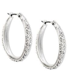 Stylish with a classic aesthetic. Enchanting crystal pave accents add flair to these oval hoop earrings from Jones New York. Crafted with worn silver tone mixed metal. Approximate drop: 1-1/4 inches. Approximate diameter: 1 inch. Stylish with a classic aesthetic. Enchanting crystal pave accents add flair to these oval hoop earrings from Jones New York. Crafted with worn silver tone mixed metal. Approximate drop: 1-1/4 inches. Approximate diameter: 1 inch.