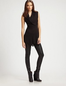 Asymmetrical crossover v-neck and an uneven hem revive this lengthy, matte jersey top. Asymmetrical crossover v-neckSleevelessAsymmetrical hem80% acetate/20% polyamideDry cleanMade in USA of Italian fabricModel shown is 5'10 (177cm) wearing US size Small. Asymmetrical crossover v-neck and an uneven hem revive this lengthy, matte jersey top. Asymmetrical crossover v-neckSleevelessAsymmetrical hem80% acetate/20% polyamideDry cleanMade in USA of Italian fabricModel shown is 5'10 (177cm) wearing US size Small.
