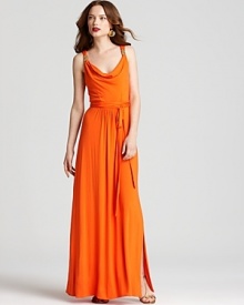 A gracefully elegant Milly maxi dress takes on summer flair with a luscious citrus hue that transports you to an island paradise no matter where you're celebrating. A gracefully elegant Milly maxi dress takes on summer flair with a luscious citrus hue that transports you to an island paradise no matter where you're celebrating.