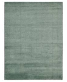 Skilled hand-carving creates an absorbing geometric block pattern on this premium Nourison area rug. Crafted with the timeless art of Tibetan hand-knotting, this deep blue piece features a soft blend of wool and Luxcelle fibers for a distinctive, satiny texture and sheen. Skilled hand-carving creates an absorbing geometric block pattern on this premium Nourison area rug. Crafted with the timeless art of Tibetan hand-knotting, this deep blue piece features a soft blend of wool and Luxcelle fibers for a distinctive, satiny texture and sheen.