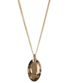 Become the center of attention with this pendant necklace from Kenneth Cole New York. Crafted from gold-tone mixed metal, the chains hold a stunning topaz-colored oval pendant with glistening accents. Item comes packaged in a signature Kenneth Cole New York Gift Box. Approximate length: 16 inches + 3-inch extender. Approximate drop: 1-3/4 inches. Become the center of attention with this pendant necklace from Kenneth Cole New York. Crafted from gold-tone mixed metal, the chains hold a stunning topaz-colored oval pendant with glistening accents. Item comes packaged in a signature Kenneth Cole New York Gift Box. Approximate length: 16 inches + 3-inch extender. Approximate drop: 1-3/4 inches.