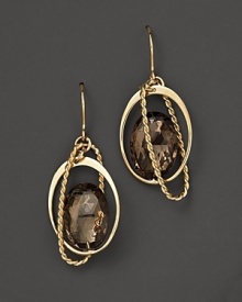 Oval freeform smoky quartz briolettes add rich sparkle to links of 14K yellow gold. By Nancy B. Oval freeform smoky quartz briolettes add rich sparkle to links of 14K yellow gold. By Nancy B.