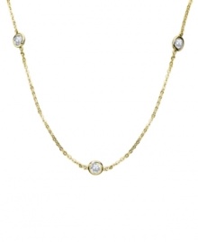 Glamour for miles. CRISLU's luxurious long necklace features bezel-set, round-cut cubic zirconias (3-1/4 ct. t.w.) strung from a delicate chain. Crafted in 18k gold over sterling silver. Approximate length: 36 inches + 2-inch extender. Glamour for miles. CRISLU's luxurious long necklace features bezel-set, round-cut cubic zirconias (3-1/4 ct. t.w.) strung from a delicate chain. Crafted in 18k gold over sterling silver. Approximate length: 36 inches + 2-inch extender.