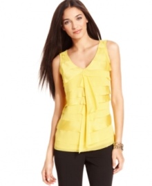 Flirty, fluttery tiers transition Alfani's sleeveless tank from layering basic to chic essential. It's perfect for adding a pop of color under a suit jacket or making a statement all on its own. Flirty, fluttery tiers transition Alfani's sleeveless tank from layering basic to chic essential. It's perfect for adding a pop of color under a suit jacket or making a statement all on its own.